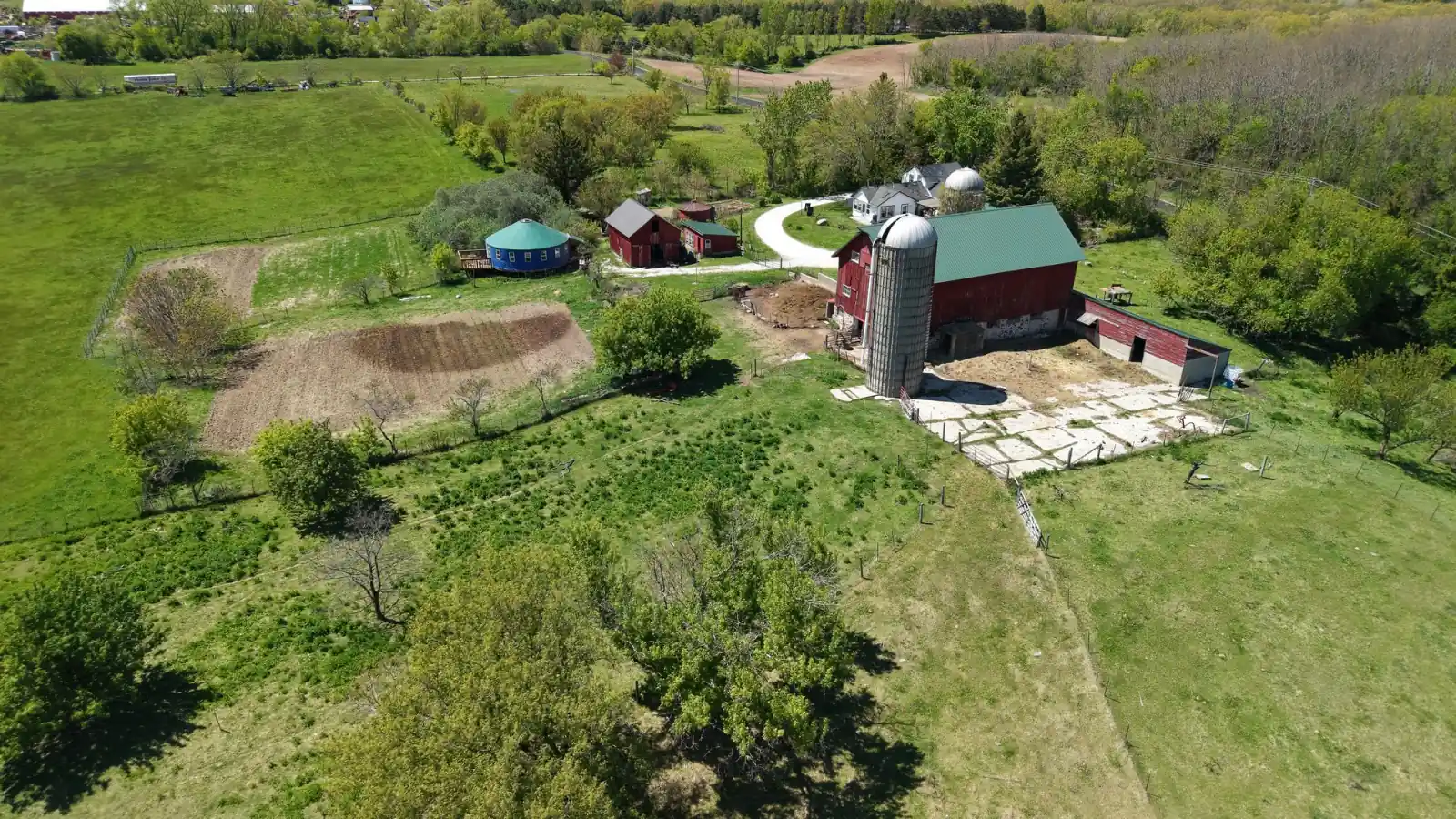 Barn, silo, round heated yurt and tilled garden beds at the Goldstein Farm, Spring Prairie, Wisconsin