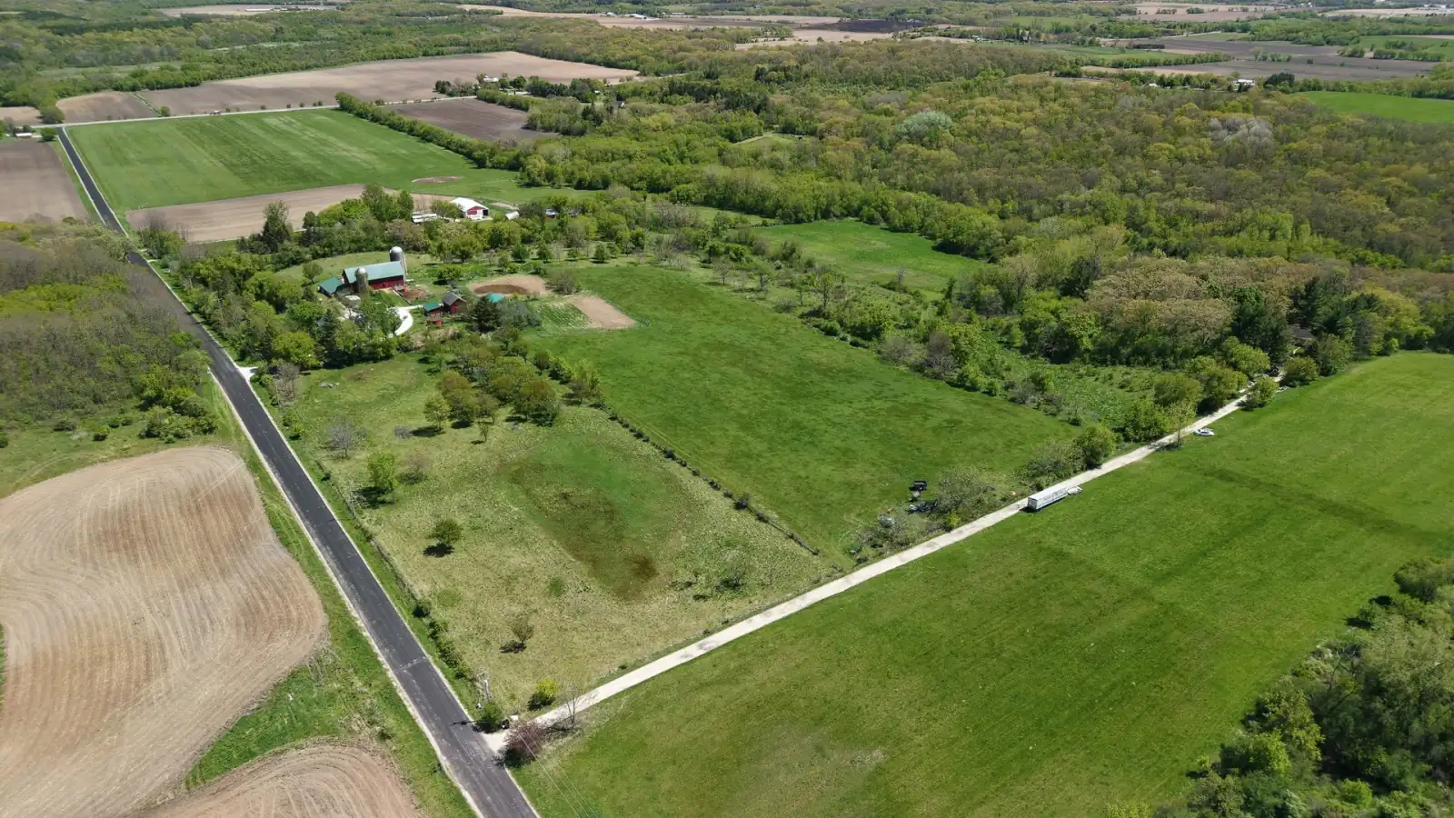 The Goldstein Farm parcel among neighboring fields and hardwoods near Elkhorn and East Troy, Wisconsin