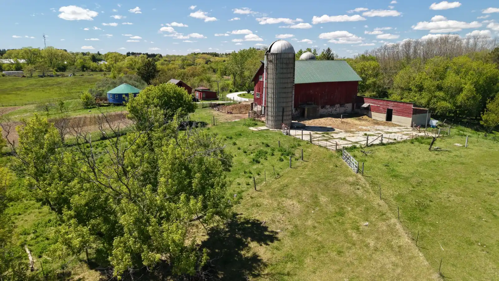 Silo, red barn and the round yurt across the pasture at the Goldstein Farm, Walworth County, Wisconsin